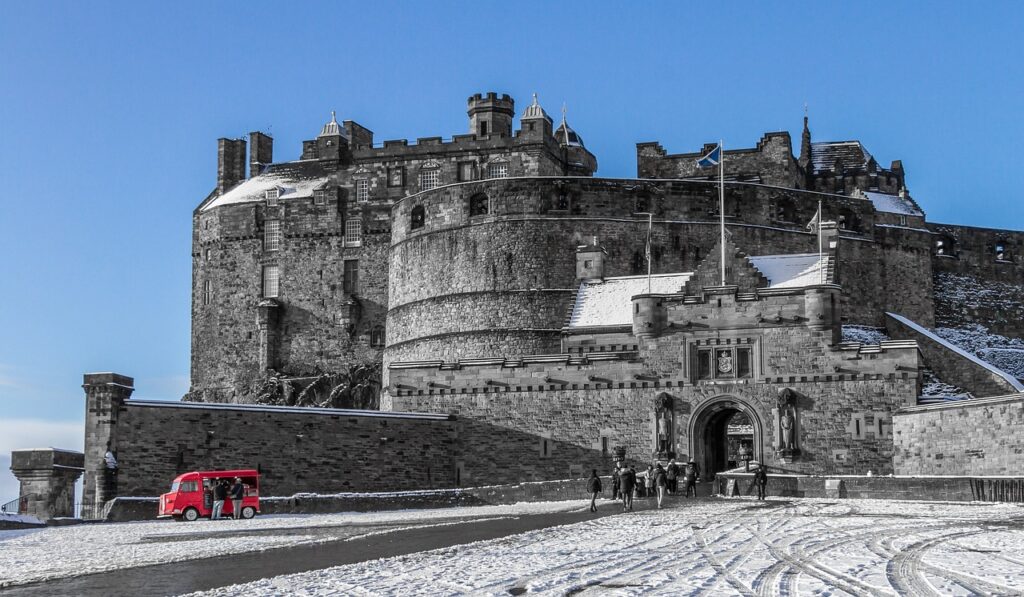 After snowfall view of huge Edinburgh Castle, Scotland.