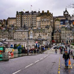 Edinburgh's Waverley Bridge with bustling crowds, historic architecture, and cityscape views