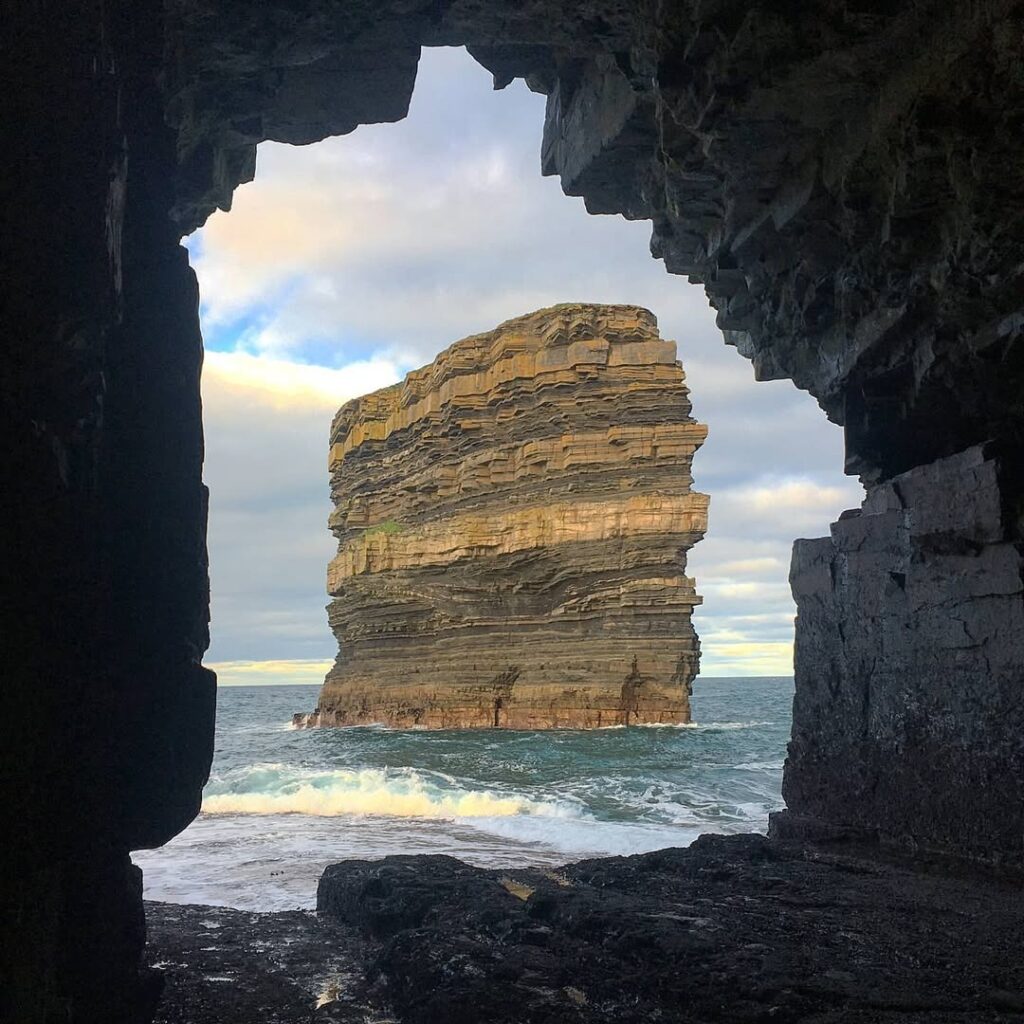Downpatrick Head Sea Stack in Ireland Framed by a Coastal Cave