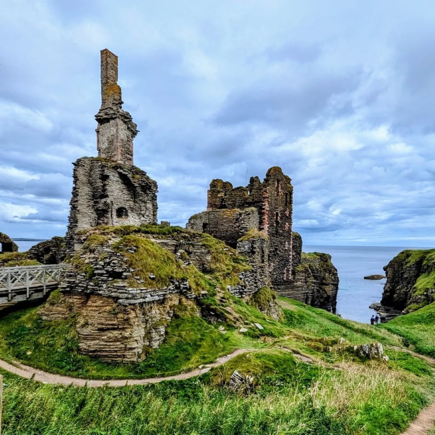 Castle Sinclair Girnigoe is perched on a cliffside overlooking the sea. It showcases medieval ruins along the North Coast 500 Scotland.